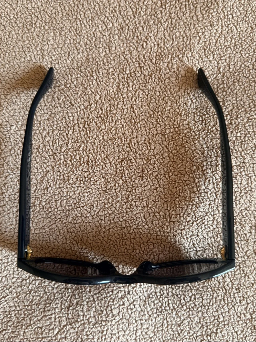 Gucci Black Oval Sunglasses with Gold Logo Accent